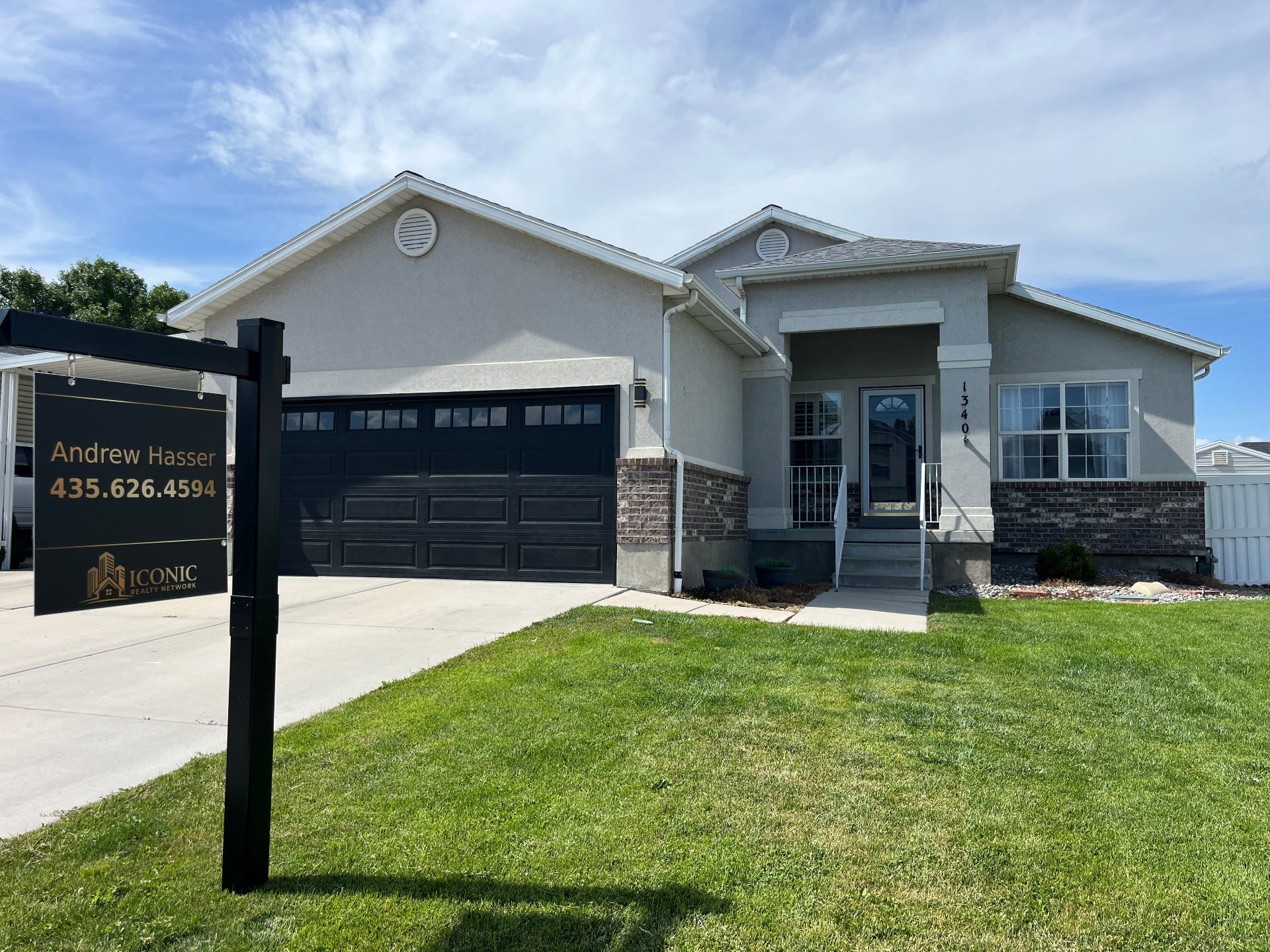 Single-story home near Hill AFB with Andrew Hasser yard sign